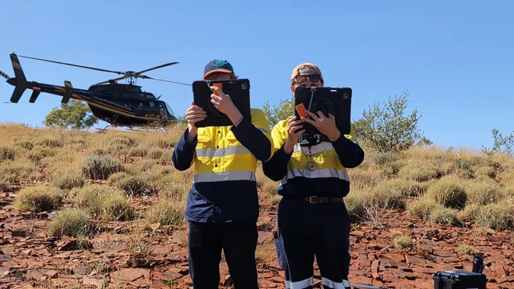 geaar augmented reality cody and andrey in front of a helicopter in the pilbarra