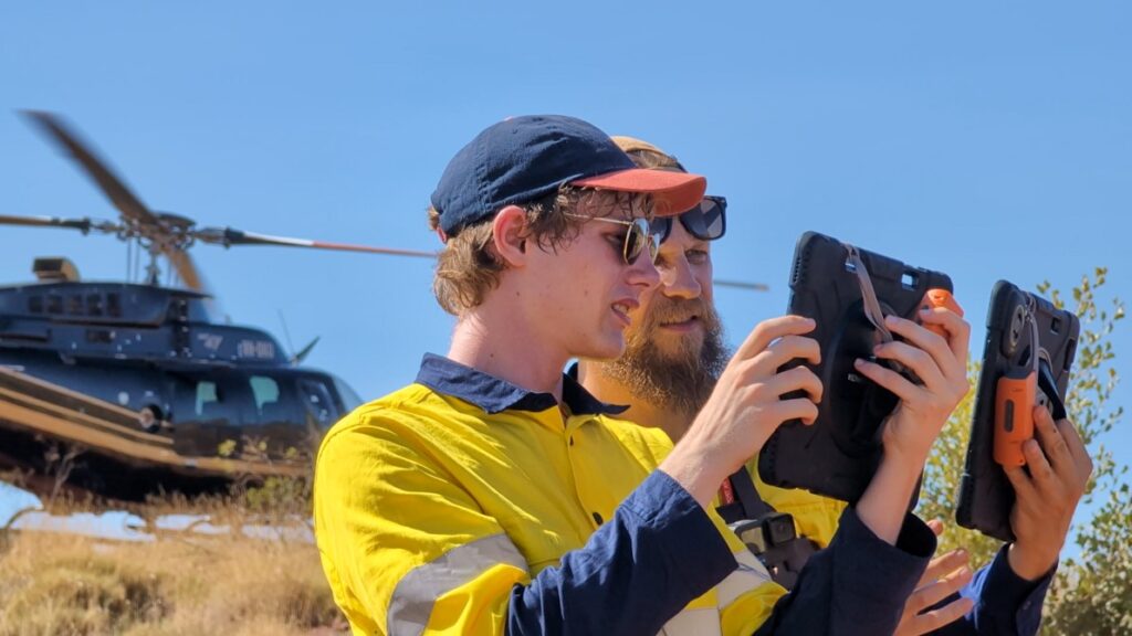 geaar augmented reality cody and andrey in front of a helicopter
